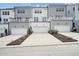 Townhouse rear elevation showing private garages and backyard at 448 Billingshurst Way # 197, Knightdale, NC 27545