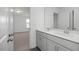 Modern bathroom with a double vanity sink and gray cabinets at 135 Grading Stick Ct, Angier, NC 27501