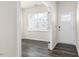 Bright foyer with dark hardwood floors and double doors at 408 Ashley Run, Sanford, NC 27330