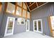 Enclosed back porch with multiple doors and windows at 1203 Keith Hills Rd, Lillington, NC 27546