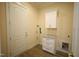 Convenient laundry room with cabinets, drawers, and granite countertop at 1203 Keith Hills Rd, Lillington, NC 27546