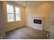 Cozy bedroom with hardwood floors, a fireplace, and large windows at 1203 Keith Hills Rd, Lillington, NC 27546