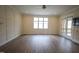 Bright living room features hardwood floors, recessed lighting, and access to a back porch at 1203 Keith Hills Rd, Lillington, NC 27546