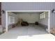 Spacious garage with shelving and room for lawn equipment at 1203 Keith Hills Rd, Lillington, NC 27546