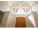 Two-story entryway with a dramatic window and double doors at 1203 Keith Hills Rd, Lillington, NC 27546