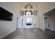 Bright living room with hardwood floors, fireplace, and wall of windows at 1203 Keith Hills Rd, Lillington, NC 27546