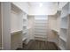 Spacious walk-in closet with ample shelving and hanging rods at 1203 Keith Hills Rd, Lillington, NC 27546