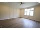 Spacious bedroom with wood-look floors and ceiling fan at 1203 Keith Hills Rd, Lillington, NC 27546