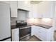 Modern kitchen with stainless steel appliances and white cabinets at 1203 Keith Hills Rd, Lillington, NC 27546