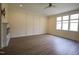 Bedroom with fireplace, wood-look floors and ceiling fan at 1203 Keith Hills Rd, Lillington, NC 27546