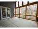 Spacious screened porch with view of wooded area at 1203 Keith Hills Rd, Lillington, NC 27546