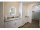 Bathroom boasts a granite vanity, large mirror, and access to a walk-in closet at 1203 Keith Hills Rd, Lillington, NC 27546