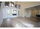 Spacious living room featuring hardwood floors, a fireplace, and large windows at 1203 Keith Hills Rd, Lillington, NC 27546