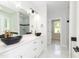 Modern bathroom with double vanity, marble floors and a walk-in shower at 114 Shaman Dr, Louisburg, NC 27549