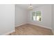 Simple bedroom with wood floors and a window at 114 Shaman Dr, Louisburg, NC 27549