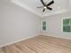 Spacious bedroom with hardwood floors and ceiling fan at 114 Shaman Dr, Louisburg, NC 27549