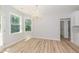 Elegant dining room features hardwood floors and a crystal chandelier at 114 Shaman Dr, Louisburg, NC 27549