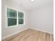 Well-lit bedroom with hardwood floors and a large window at 114 Shaman Dr, Louisburg, NC 27549