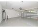 Spacious garage with open floor plan and overhead storage at 114 Shaman Dr, Louisburg, NC 27549