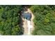 House and property aerial view, showing wooded surroundings at 114 Shaman Dr, Louisburg, NC 27549