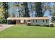 Brick ranch home with a large grassy yard at 2400 Carbonton Rd, Sanford, NC 27330