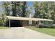 Brick ranch home with carport and a large front yard at 2400 Carbonton Rd, Sanford, NC 27330