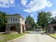 Gated community entrance with a stone guardhouse at 3192 Castlerock Dr, Burlington, NC 27215