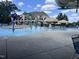 Community pool with water features and lounge chairs at 3192 Castlerock Dr, Burlington, NC 27215