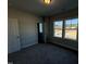 Bright bedroom with double windows and grey carpet at 1005 Bostonian Dr, Knightdale, NC 27545