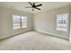 Spacious bedroom with carpet flooring and ceiling fan at 36 Kevior Ave, Four Oaks, NC 27524