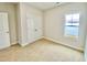 Bright bedroom with double door closet and carpeted floor at 36 Kevior Ave, Four Oaks, NC 27524