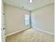 Bedroom with carpeted floor and a window at 36 Kevior Ave, Four Oaks, NC 27524