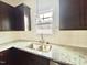 Kitchen features granite countertops and double sink at 36 Kevior Ave, Four Oaks, NC 27524
