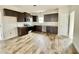Modern kitchen with dark cabinets and granite countertops at 36 Kevior Ave, Four Oaks, NC 27524