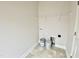 Laundry room with shelving and tile floor at 36 Kevior Ave, Four Oaks, NC 27524