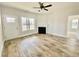 Bright living room features hardwood floors, fireplace, and neutral walls at 36 Kevior Ave, Four Oaks, NC 27524