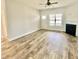 Open living room with hardwood floors and fireplace at 36 Kevior Ave, Four Oaks, NC 27524