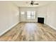 Spacious living room with hardwood floors and a fireplace at 36 Kevior Ave, Four Oaks, NC 27524