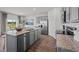 Island kitchen with granite countertops and stainless steel appliances at 2209 Fletchers Ridge Dr, Durham, NC 27703
