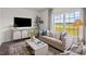 Living room with comfortable seating and a view of the backyard at 2209 Fletchers Ridge Dr, Durham, NC 27703