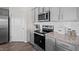 Modern kitchen featuring granite countertops and stainless steel appliances at 2209 Fletchers Ridge Dr, Durham, NC 27703