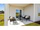 Relaxing covered patio with outdoor furniture, perfect for entertaining at 2209 Fletchers Ridge Dr, Durham, NC 27703