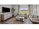 Cozy living room with large window, comfortable seating, and a view at 2209 Fletchers Ridge Dr, Durham, NC 27703