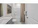 Clean bathroom with tub/shower combo and modern vanity at 2209 Fletchers Ridge Dr, Durham, NC 27703