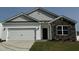 Two-story home with stone accents and attached garage at 2209 Fletchers Ridge Dr, Durham, NC 27703