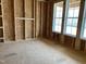 Framed room under construction with windows and subfloor at 399 W Amber Oak Dr # 52, Selma, NC 27576