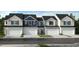 Four townhomes with attached garages and neutral siding at 136 Malbec Dr, Chapel Hill, NC 27516