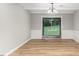 Bright dining room with hardwood floors and sliding glass doors at 2113 Eveton Ln, Sanford, NC 27330