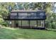 Back exterior of house showcasing a deck and backyard at 2113 Eveton Ln, Sanford, NC 27330