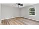 Bedroom with ceiling fan and large window at 2113 Eveton Ln, Sanford, NC 27330